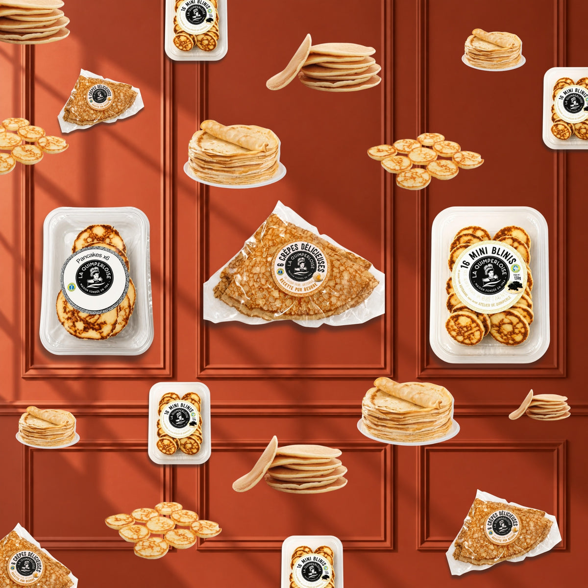 French crêpes, pancakes and mini blinis falling against a terracotta wall
